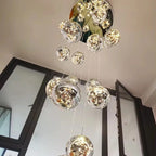 AstraLumen Glass Orb Staircase Chandelier Elevates Stairway Lighting