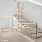 AstraLumen Glass Orb Staircase Chandelier Elevates Stairway Lighting